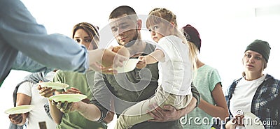 Volunteer serving food for poor people Stock Photo