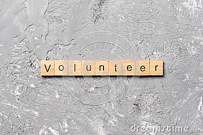 Volunteer word written on wood block. volunteer text on table, concept Stock Photo