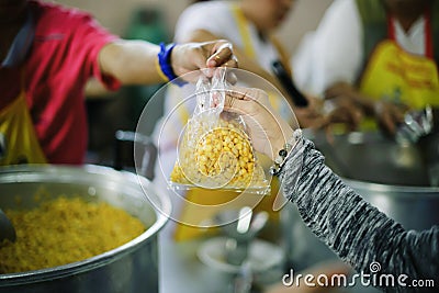 Volunteers are giving food to the homeless poor : the concept of humane Stock Photo