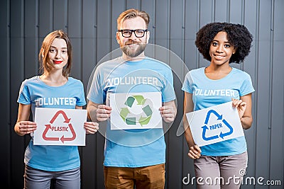 Volunteers with signs of sorting waste Stock Photo