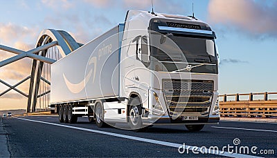 Volvo truck with a trailer bearing the Amazon Prime logo Editorial Stock Photo