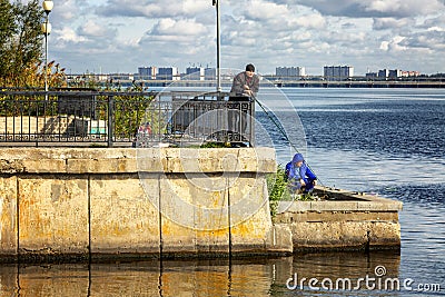 Voronezh, Russia, 09/24/2016: Fishermen catch fish on the city embankment Editorial Stock Photo