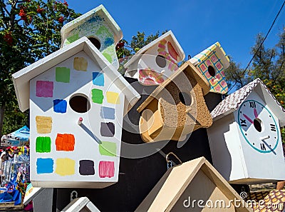 Several new birdhouses painted with paints Editorial Stock Photo