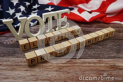 Vote Election Presidential Word alphabet letters with USA flag on wooden background Stock Photo