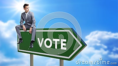 Vote Green Road Sign Against Clouds and Sunburst Stock Photo