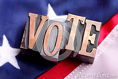 VOTE letters on American Flag Stock Photo