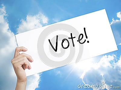 Vote! Sign on white paper. Man Hand Holding Paper with text. Iso Stock Photo