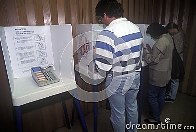 Voters and voting booths in a polling place Editorial Stock Photo