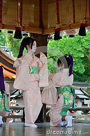 Votive dance by Maiko girls, Gion festival scene. Editorial Stock Photo