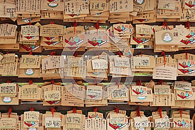 Votive plaques are hung in the courtyard of a shintoist shrine (Japan) Editorial Stock Photo