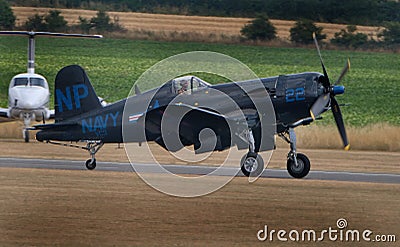 Vought F4U Corsair. The Vought F4U Corsair is an American fighter aircraft that saw service primarily in World War II and the Kore Editorial Stock Photo