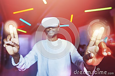 Vr headset with 3D futuristic hologram screen with hand with tech for digital metaverse. Black man or future cyber cloud Stock Photo