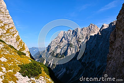 Vrata valley and mountain peak lit by sunlight rising above Stock Photo