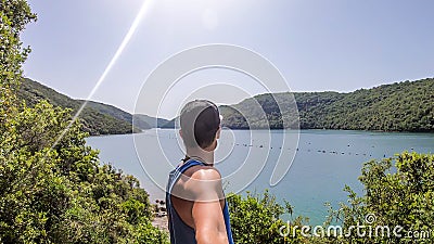Vrsar - Young man taking a selfie with a fjord Stock Photo