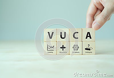 VUCA and strategic management. Wooden cubes with VUCA ico Stock Photo