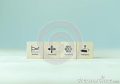 VUCA and strategic management. Wooden cubes with VUCA icon Stock Photo