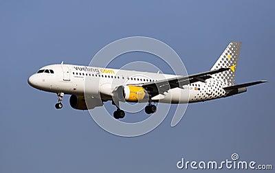 Vueling airliner EC-LOP landing in El Prat Airport in Barcelona Editorial Stock Photo