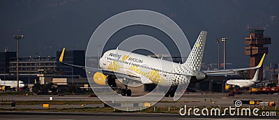 Vueling airliner landing in El Prat Airport in Barcelona Editorial Stock Photo