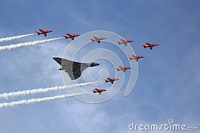 Vulcan Bomber and Red Arrows Editorial Stock Photo