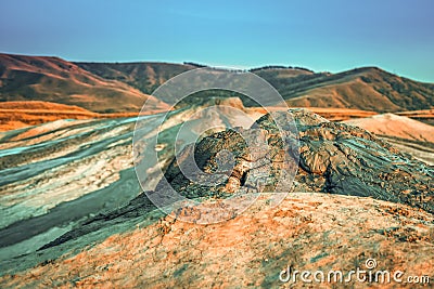 Vulcanii noroiosi Mud Volcanoes Romania lanscape sunset rocky dry landmark Stock Photo