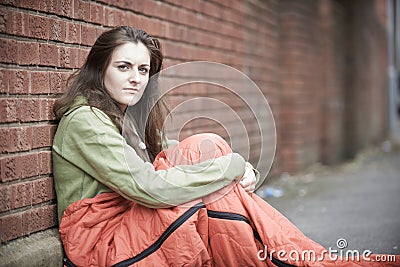 Vulnerable Teenage Girl Sleeping On The Street Stock Photo