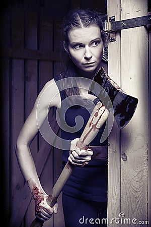 Kidnapped woman in black underwear fighting for escape from basement Stock Photo