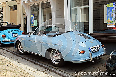 VW beetle and Porsche oldtimer car in Kettwig, district of Essen. Editorial Stock Photo