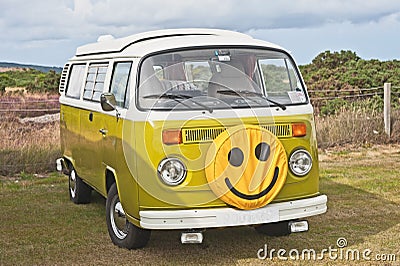 VW caravanette with smiley face Stock Photo