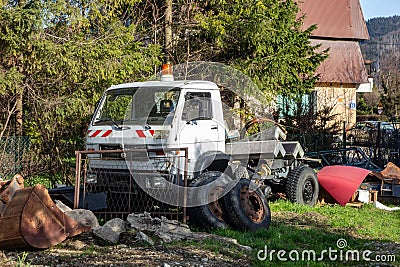 VW MAN 8.150 truck wreck in graden with rusty wheels Editorial Stock Photo