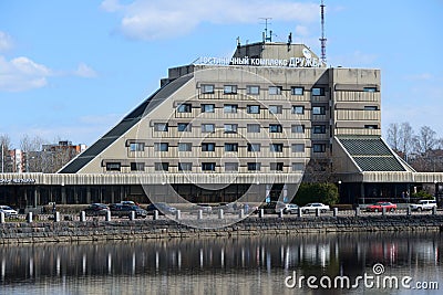 Vyborg, Russia, May 2, 2021-Hotel Druzhba in Vyborg. Hotel stands on the lake shore. Reflection of the hotel in the lake water Editorial Stock Photo