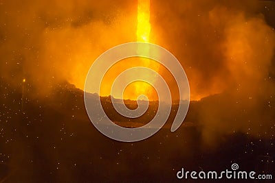 Liquid steel flowing in ironwork. Industrial details of metallurgic plant. Steel smelting Stock Photo