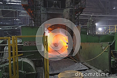 Vyksa, Russia: 12.23.2018. Steel press rolling industrial workshop. Hot iron stamping of train and wagon wheels. Industrial Editorial Stock Photo
