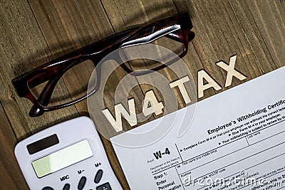 W4 Tax form Employee Withholding Certificate concept to declare multiple jobs or change withholding amount Editorial Stock Photo