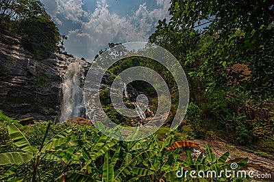 Wachirathan waterfall surrounded by lush tropical forest in Doi Inthanon National Park near Chiang Mai Stock Photo