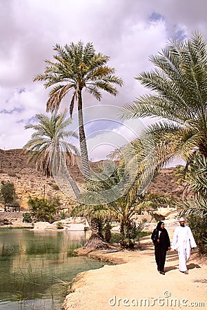 WADI BANI KHALID, OMAN - FEBRUARY 5, 2012: An Omani couple visiting Wadi Bani Khalid in Sharqiya Editorial Stock Photo