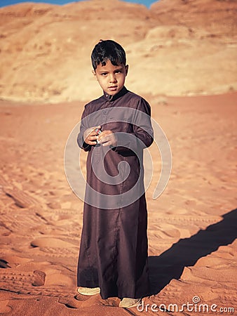 Wadi Rum, Jordan, February 16th 2023, Child wearing traditional clothes in Wadi Rum Editorial Stock Photo