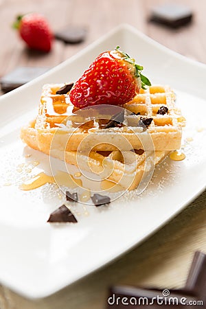 Waffel with strawberry, honey and chocolate Stock Photo