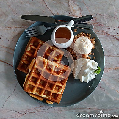 Waffle with syrup waffle with ice-cream waffle with strawberry waffle with whip cream waffle on wooden table yummy waffle fresh wa Stock Photo