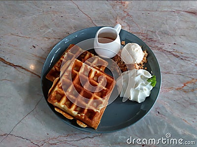 Waffle with syrup waffle with ice-cream waffle with strawberry waffle with whip cream waffle on wooden table yummy waffle fresh wa Stock Photo