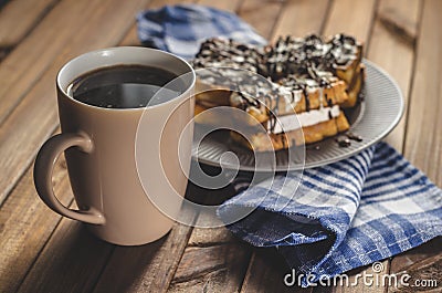 Waffles with cream and chocolate on the plate and coffee Stock Photo