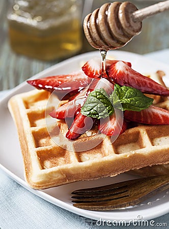 Waffles with strawberry and honey Stock Photo
