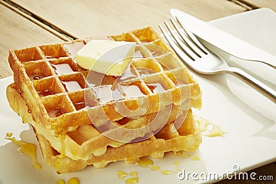 Waffles with syrup on white dish Stock Photo
