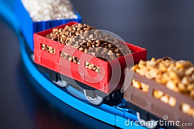 Wagons with grain of buckwheat, rice and peas. Grain Cultures. Stock Photo