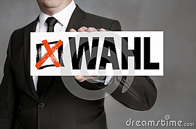 Wahl in german Election sign is held by businessman Stock Photo