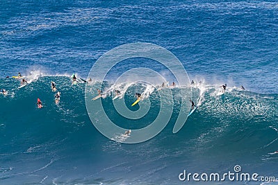 Waimea bay Oahu Hawaii, Surfers ride a big wave Editorial Stock Photo