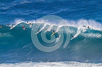 Waimea bay Oahu Hawaii, Surfers ride a big wave Editorial Stock Photo