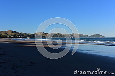 Wainui Beach with great view of nearby mountain ridges in Gisborne, Hawkes Bay in New Zealand Stock Photo