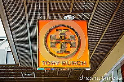 Tory Burch fashion label emblem on hanging boutique shop at Waikele Premium Outlets Editorial Stock Photo