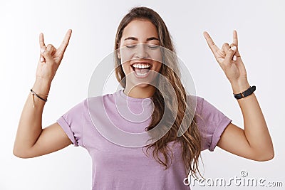 Waist-up energized carefree attractive young millennial lucky girl winning ticket favorite concert yelling yeah enjoying Stock Photo