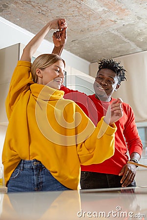 Waist up photo of two happy people dancing and smiling Stock Photo